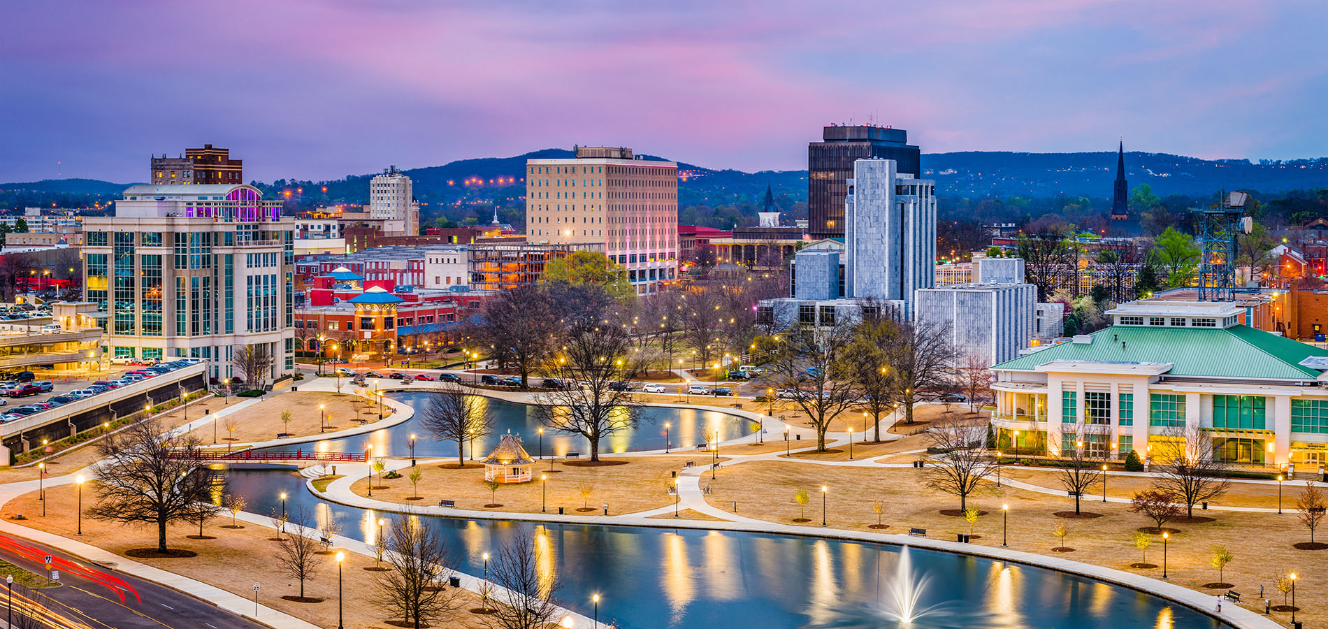 A modern dental practice with a blue and white chair, a dental treatment table, and medical equipment.