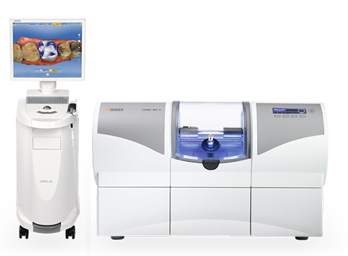 The image shows a modern dental office setup with various pieces of equipment, including a digital display screen, a large machine likely used for dental procedures, and a smaller device that could be an X-ray or scanner.